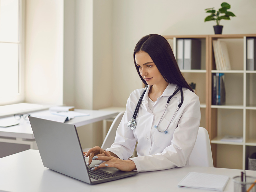 Ness licensed physician reviewing patient intake forms