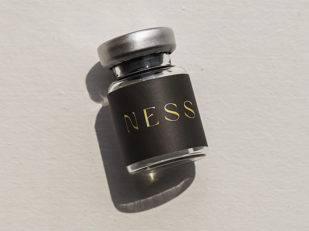 Ness vial laying flat on surface