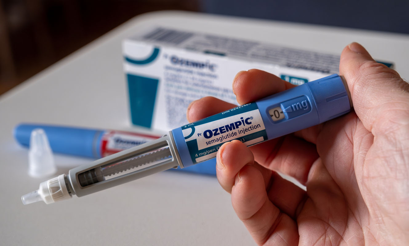 Ozempic semaglutide ness healthcare Person holding ozempic semaglutide pen for weight loss, ness healthcare