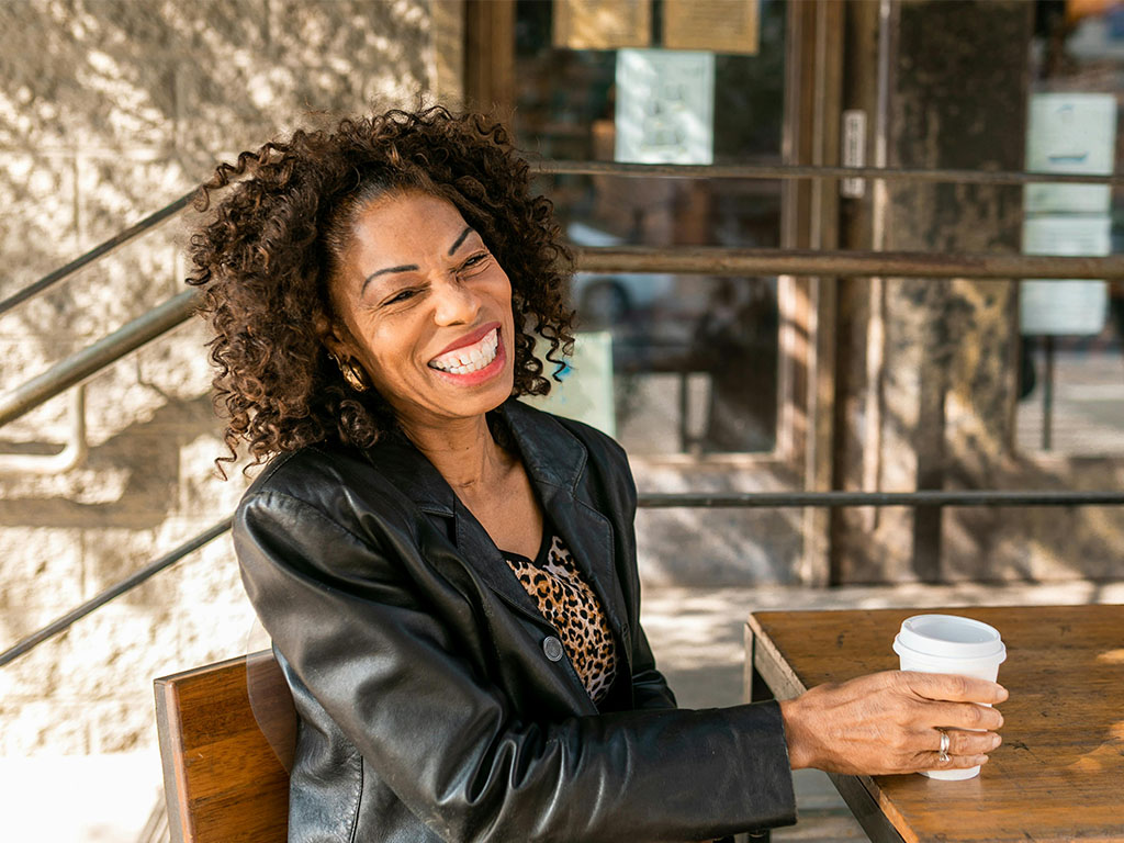 mature woman laughing outdoors mature woman laughing outdoors
